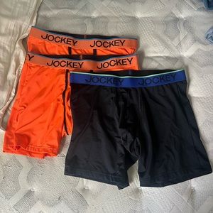 2 orange and 1 black jockey boxerbriefs size large